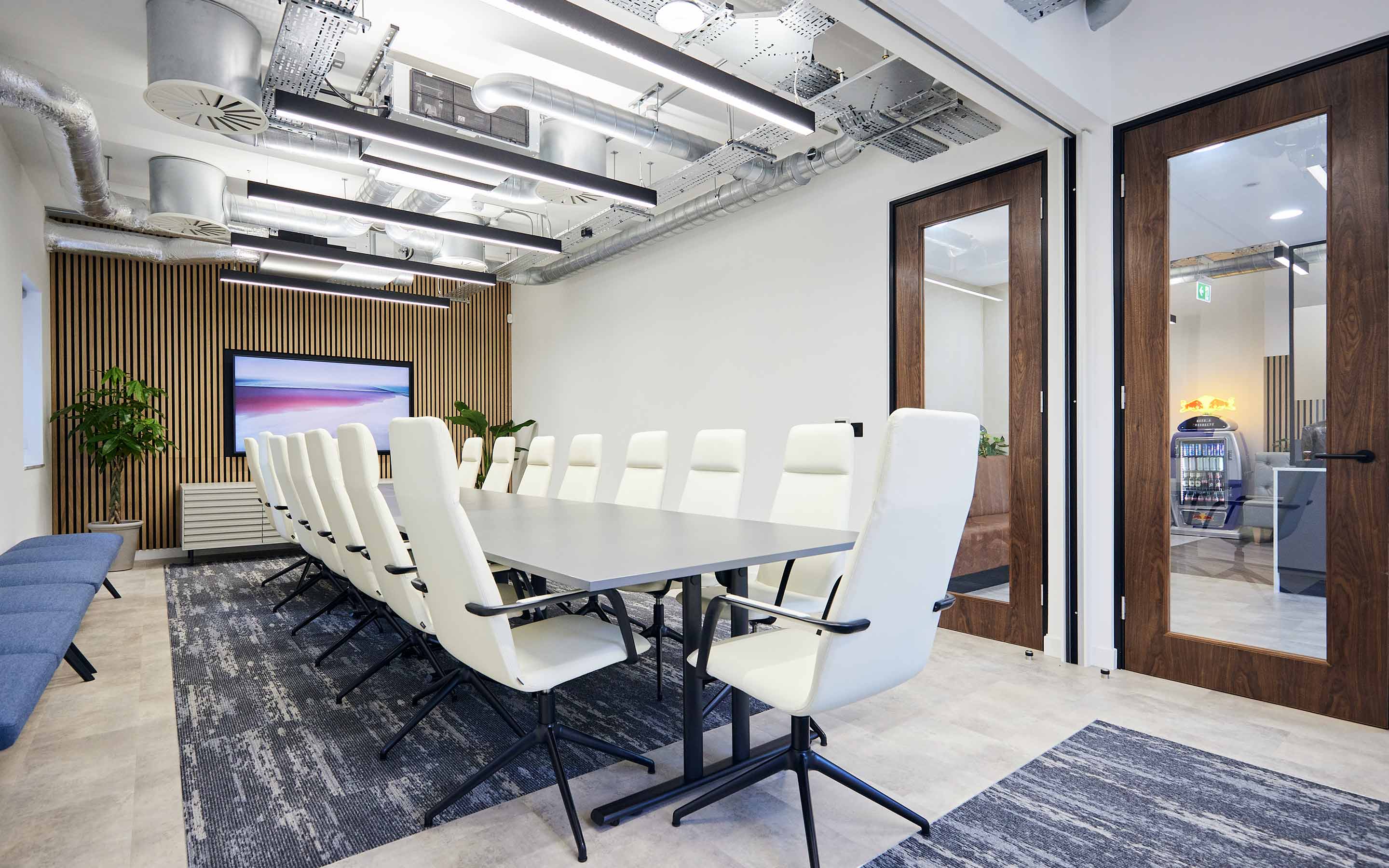 Chic office interior design showcasing elegant decor, ergonomic furniture, and a cozy ambiance in a professional meeting room