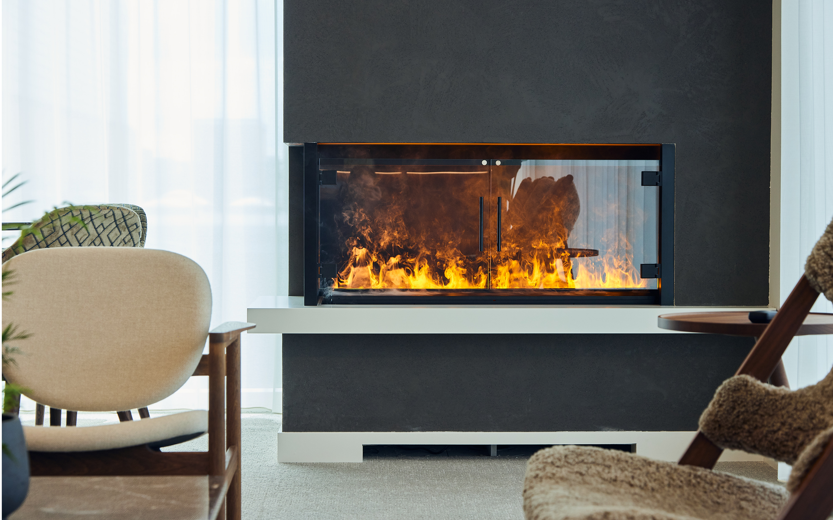 Fireplace surrounded by comfy seating in Napier Park's workspace library.