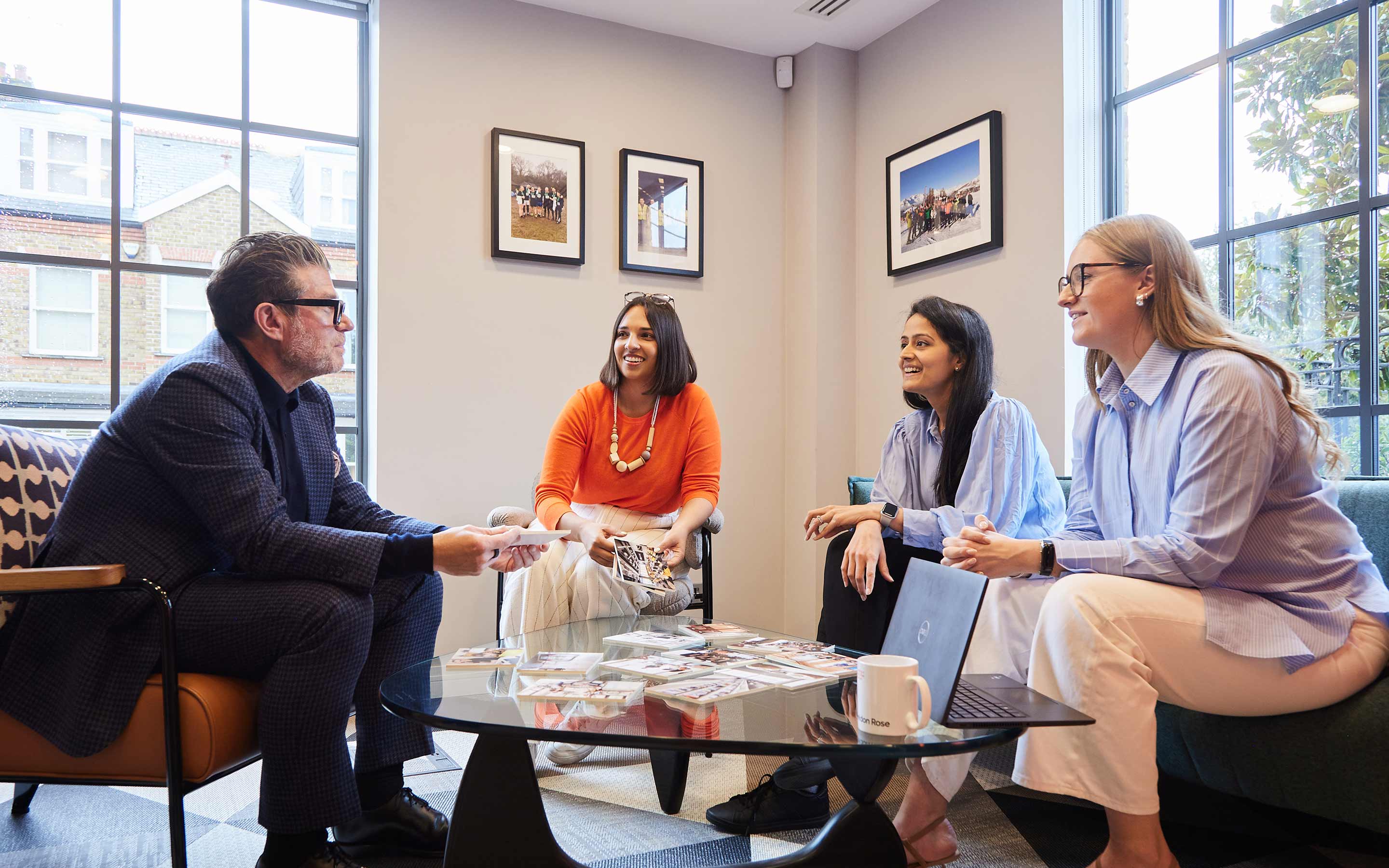 Colleagues collaborating in a relaxed meeting setting, in a contemporary office interior design